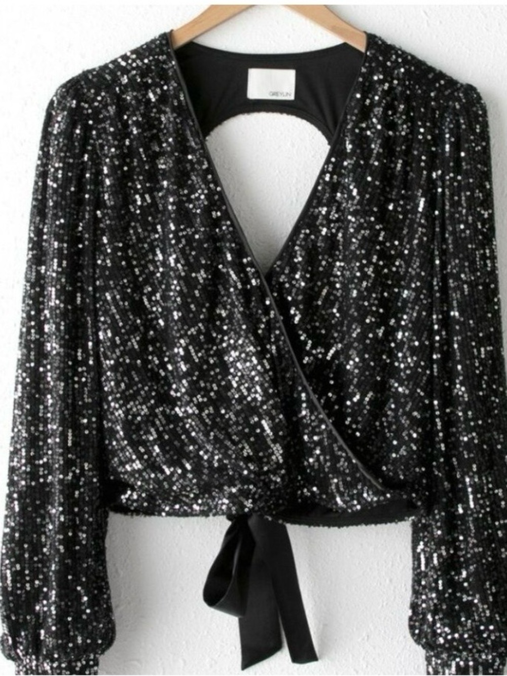 Greylin Eliza Open Back Sequin Top in black. Long sleeve crop top